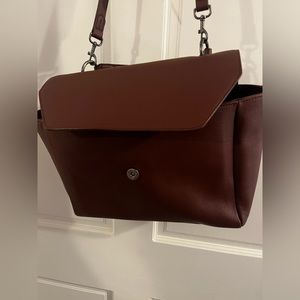 Cross body purse, great for work. Brownish purple, great condition.